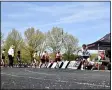  ?? PAUL DICICCO — FOR THE NEWS-HERALD ?? Runners await a baton exchange May 1 during the Mentor Cardinal Relays.