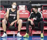  ?? CHRIS SZAGOLA AP ?? Kelly Olynyk, left, and Tyler Herro were among only eight players available for the two games at Philadelph­ia this week.