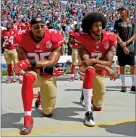  ?? AP FILE PHOTO BY MIKE MCCARN ?? In this 2016 photo, San Francisco 49ers’ Colin Kaepernick (7) and Eric Reid (35) kneel during the national anthem.