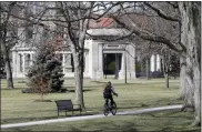  ?? TONY DEJAK — THE ASSOCIATED PRESS FILE ?? A student rides a bicycle on the campus of Oberlin College in Oberlin, March 5, 2013. Oberlin College has completed paying out a $25million judgment to an Ohio bakery that won a libel lawsuit against the school after a shopliftin­g incident involving three Black students.