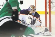  ?? Ronald Martinez / Getty Images ?? Oilers goalie Cam Talbot is beaten by the Stars’ Alexander Radulov in the first period in Dallas.