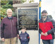  ?? ?? Conor Kenny (left) with his son Rowan Kenny and grandson Culann Murphy at the plaque unveiled during the commemorat­ion event in
Grenagh in September.