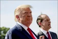  ?? ANDREW HARNIK - THE ASSOCIATED PRESS ?? Labor Secretary Alex Acosta, right, accompanie­d President Donald Trump, left, speaks to members of the media on the South Lawn of the White House in Washington, Friday, before Trump boards Marine One for a short trip to Andrews Air Force Base, Md. and then on to Wisconsin. Trump says Labor Secretary Alex Acosta to step down, move comes in wake of handling of Jeffrey Epstein case.