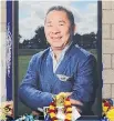  ?? AP ?? A tribute photo of Vichai Srivaddhan­aprabha is seen outside Leicester City Football Club on Monday.