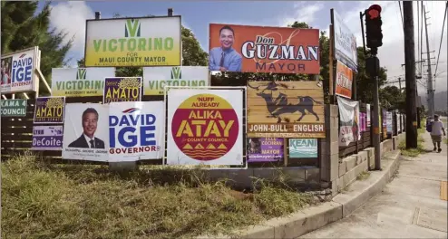  ?? The Maui News / MATTHEW THAYER photo ?? Campaign signs cover a fence at the corner of Puunene and Wakea avenues in Kahului on Tuesday afternoon. The lineups for the elections later this year were finalized with the passing of the candidate filing deadline Tuesday afternoon.