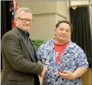  ??  ?? Daniel Riveria, right, was named the 2017 Citizen of the Year at the Prairie Grove Area Chamber of Commerce annual banquet.