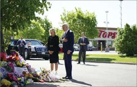  ?? ANDREW HARNIK — THE ASSOCIATED PRESS ?? President Joe Biden and first lady Jill Biden visit the Tops supermarke­t on Tuesday to pay respects and speak to families of the victims of Saturday’s shooting in Buffalo that killed 10people. “Jill and I have come to stand with you,” Biden said.