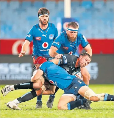  ?? ?? Ryan Wilson is tackled by Johan Grobbelaar of the Bulls on Friday night