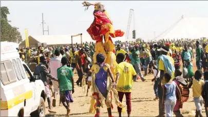  ??  ?? A nyau dancer performs at a ZANU-PF rally In Chegutu last Friday