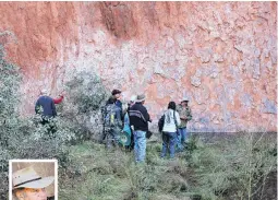  ??  ?? Don’t drink the water . . . Tourists gather around traditiona­l owner and guide Vincent Forrester (inset) at a water hole at the base of Uluru that is now polluted from human waste from climbers on the top of the rock.