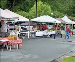  ??  ?? Wet weather didn’t deter vendors or guests at the Rockmart Farmers Market on July 18.