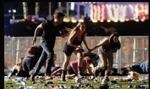  ?? PHOTOS BY DAVID BECKER / GETTY IMAGES ?? ABOVE: People run from the Route 91 Harvest country music festival after gunfire rained down Sunday night from the 32nd floor of the Mandalay Bay Hotel and Casino. MAIN: A police helicopter circles the Mandalay Bay and Luxor hotels after a shooter was...