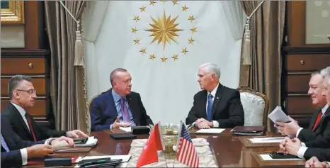  ?? XINHUA ?? Turkey’s President Recep Tayyip Erdogan (second from left) talks with US Vice-President Mike Pence during their meeting at the Presidenti­al Palace in Ankara, Turkey, on Thursday.