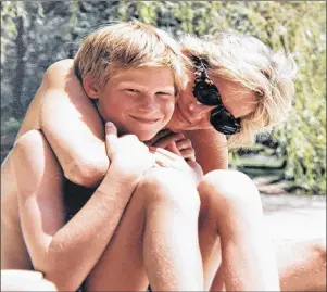  ?? AP PHOTO ?? In this photo made available by Kensington Palace from the personal photo album of the late Diana, Princess of Wales, shows the princess and Prince Harry on holiday, and features in the new ITV documentar­y ‘Diana, Our Mother: Her Life and Legacy.’...