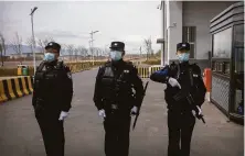  ?? Mark Schiefelbe­in / Associated Press 2021 ?? Police officers guard the Urumqi No. 3 Detention Center in Dabancheng in Xinjiang Uyghur Autonomous Region in 2021.