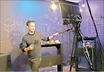  ??  ?? Langevin sets the camera he uses for a new livestream­ed magic show at his Montreal studio.