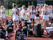  ?? MEDIANEWS GROUP ?? The Archbishop Carroll girls lacrosse team during a water break in what would become a 22-3win over Gwynedd Mercy in the first round of the PIAA Class 2A state playoffs Tuesday. The game was at Cardinal O’Hara.