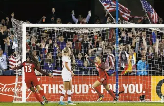  ?? Lachlan Cunningham / Getty Images ?? Carli Lloyd (10) celebrates with Cal alum Alex Morgan after scoring a goal against Canada. Lloyd, a 35-year-old midfielder, is one of the older players on a rebuilding U.S. team.