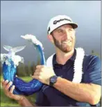  ?? AFP ?? Dustin Johnson poses with the Tournament of Champions winner’s Wanamaker trophy in Hawaii on Sunday.