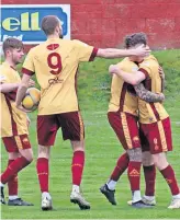  ?? ?? Equaliser Darren Liddell is mobbed by team-mates after his goal