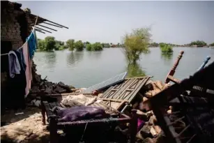  ?? (Washington Post/Saiyna Bashir) ?? A submerged village due to the recent floods in Dadu, Sindh