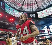  ?? HYOSUB SHIN / HYOSUB.SHIN@AJC.COM ?? Falcons running back Devonta Freeman leaves with 84 yards rushing, a touchdown and a smile Sunday after Atlanta drubbed the Carolina Panthers 40-20 at Mercedes-Benz Stadium.