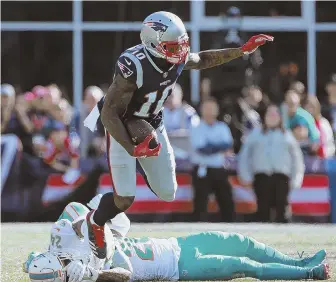  ?? STAFF PHOTO BY MATT STONE ?? STEPPING UP: Receiver Josh Gordon leaves the Miami secondary in his dust during the fourth quarter of the Pats’ win yesterday in Foxboro.