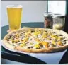  ?? Adam Jung ?? PROOF Public House’s pies veer from traditiona­l pizzas.