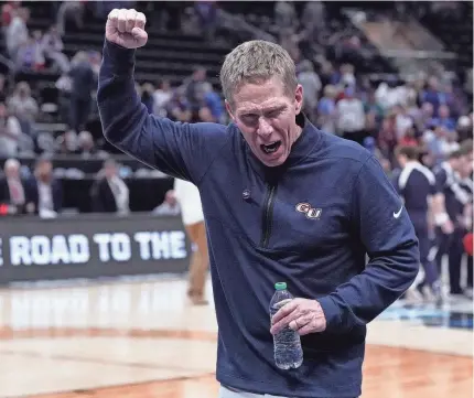  ?? GABRIEL MAYBERRY/USA TODAY SPORTS ?? Head coach Mark Few celebrates after his Gonzaga Bulldogs defeat the Kansas Jayhawks in the second round of the NCAA Tournament at Vivint Smart Home Arena-Delta Center in Salt Lake City.