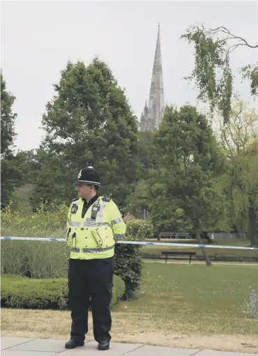  ??  ?? 0 An officer stands guard after a park was cordoned off in Salisbury yesterday