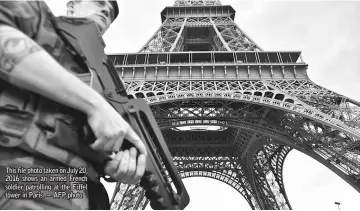  ??  ?? This file photo taken on July 20, 2016 shows an armed French soldier patrolling at the Eiffel tower in Paris. — AFP photo