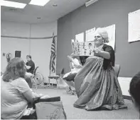  ?? COURTESY ANNE ARUNDEL COUNTY PUBLIC LIBRARY ?? Matthew Maisano performs as Balena Canto at a Drag Queen Story Time at the Severna Park library last Saturday. Mr. Maisano and library officials said two men who were shouting during the storytime were removed by police.