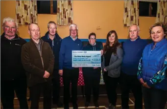  ??  ?? Members of Ballycloug­h GAA Club prensting a cheque for €22,126 to Elizabeth Ahern and Caroline O’Connell of the Rickie Healy Appeal. The money was raised through a quiz held in the village.