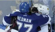  ?? PHELAN M. EBENHACK/THE ASSOCIATED PRESS ?? Victor Hedman and Andrew Shaw in the mystery scrum.