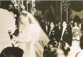  ??  ?? President Elpidio Quirino looks at his 19-year-old daughter Victoria as she weds Luis Gonzalez. Victoria became the official First Lady to her father at 16, because her mother and siblings were massacred by the Japanese before her father became president.