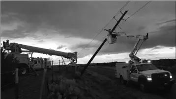  ?? LOANED PHOTO ?? APS LINEMEN RESPOND to restore power after a summer storm.