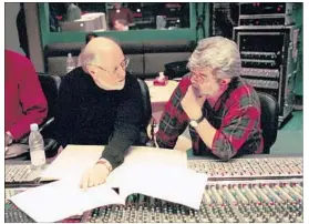  ?? Jonathan Player For The Times ?? WILLIAMS, left, discusses soundtrack with filmmaker George Lucas in 2002.