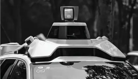  ??  ?? An autonomous taxi during a pilot test drive on the streets in Shanghai last month