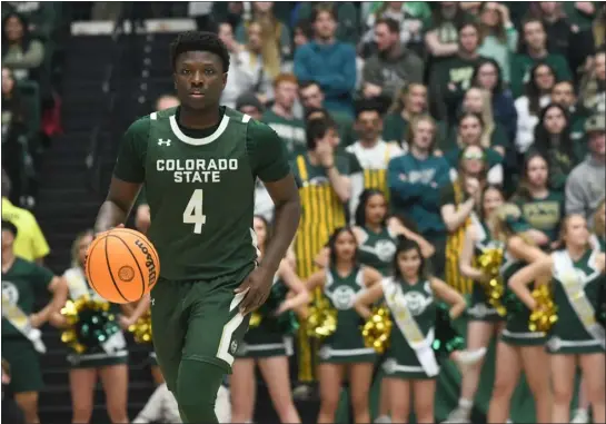  ?? ?? Colorado State senior guard Isaiah Stevens brings the ball up the court against New Mexico on Friday night at Moby Arena.