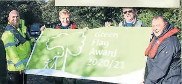  ?? ?? With the Trent & Mersey Canal’s Green Flag are, from left: CRT staff Mark Barkley, George Hammond, Alan Wrench and area operations manager Paul Reynolds.