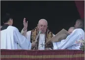  ?? GREGORIO BORGIA – THE ASSOCIATED PRESS ?? Pope Francis delivers the Urbi et Orbi (Latin for ‘to the city and to the world’ ) Christmas Day blessing from the main balcony of St. Peter’s Basilica at the Vatican on Sunday.