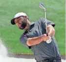  ?? MICHAEL MADRID/USA TODAY NETWORK ?? Scottie Scheffler hits out of a bunker during a practice round for the Masters at Augusta National Golf Club.