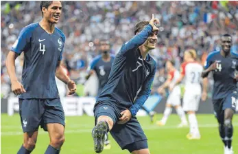  ?? FOTO: AFP ?? Dem Finale hat Antoine Griezmann seinen Stempel aufgedrück­t – da durfte sein spezieller Jubel, das L auf der Stirn, natürlich nicht fehlen.