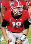  ?? CURTIS COMPTON/CURTIS.COMPTON@AJC.COM ?? JT Daniels, in his first start after missing one game with an injury, was 9-for-11 on third-down conversion­s Saturday night against South Carolina.