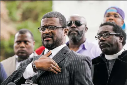  ?? The Associated Press ?? PRESS CONFERENCE: Civil rights activist John C.Barnett gestures during a press conference Wednesday in response to the police shooting of Keith Lamont Scott, in Charlotte, N.C.