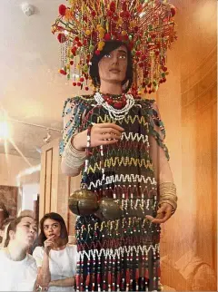  ??  ?? Priceless costume: Visitors admiring the rare Iban beaded costume on display at the Textile Museum in Kuching.