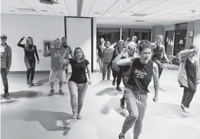  ?? CONTRIBUTE­D ?? Off-Broadway Players production of American Idiot features a large cast of 30, some of whom are seen here rehearsing a number from the show.