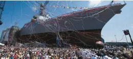  ?? ROBERT F. BUKATY/AP 2009 ?? An Arleigh-Burke-class destroyer is christened at Bath Iron Works in Bath, Maine. The Navy workhorse has served three decades but will soon be replaced.