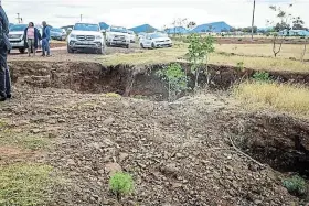  ?? Picture: SUPPLIED ?? BAD STATE: A huge hole in the middle of the road that was caused by heavy rains in Emalahleni Local Municipali­ty.