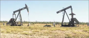  ?? RALPH K.M. HAURWITZ / AMERICAN-STATESMAN 2014 ?? Pump jacks pull oil from wells on UT System land in West Texas. A report released Tuesday asserts that wells drilled on UT System lands from 2005 to 2015 used more than 275.6 million pounds of chemicals, including hydrochlor­ic acid, methanol and other...